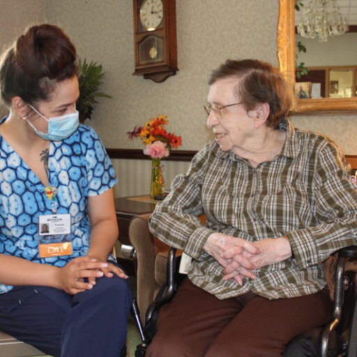 nurse working with elderly patient in healthcare careers
