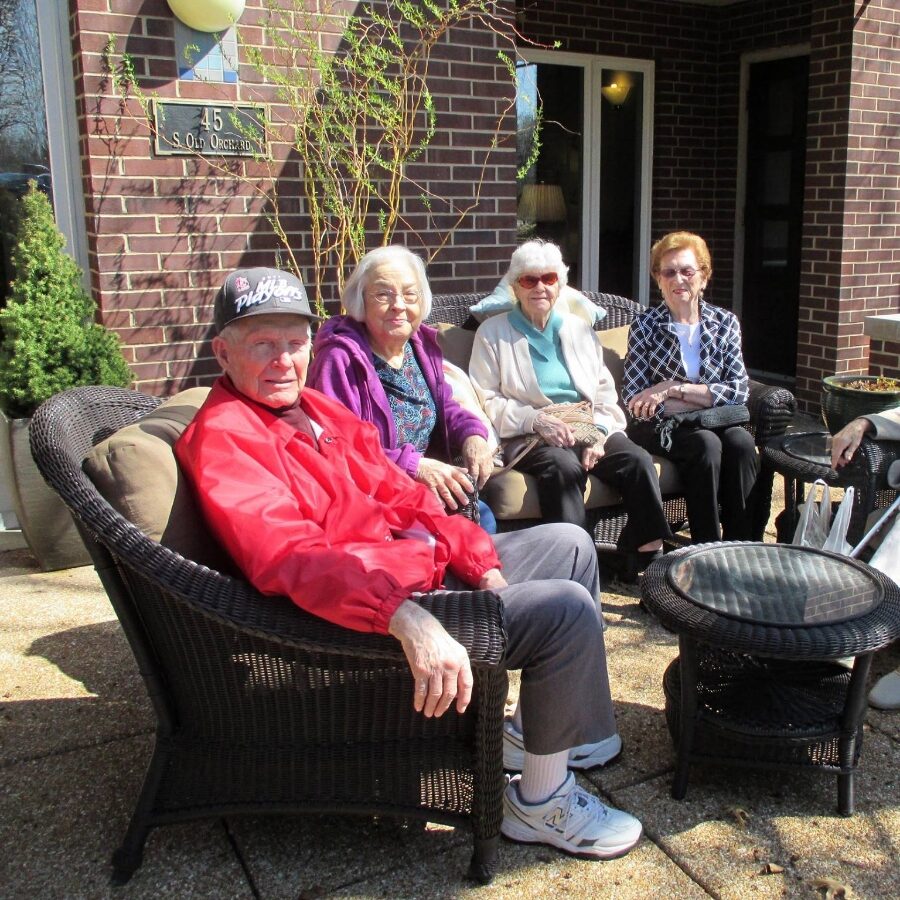 Senior friends sitting on the patio