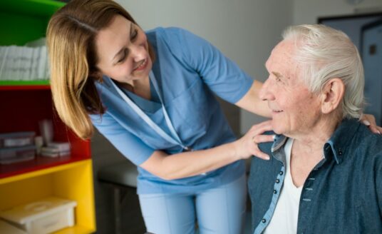 A Geriatric Care Manager works with a senior man.