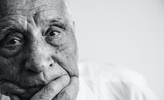 A senior man ponders mental health and aging.
