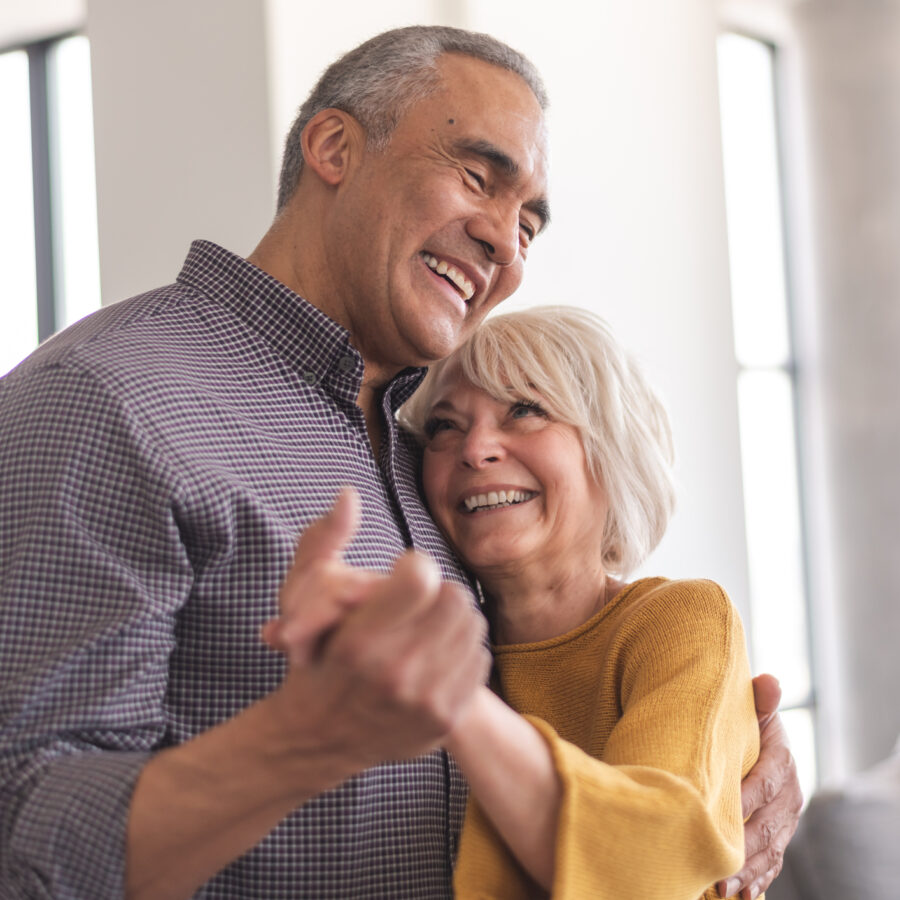 couple dancing in their new senior community
