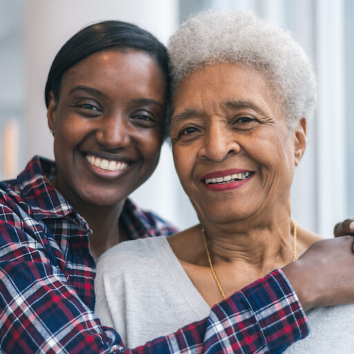 Adult woman hugging senior mother | providing quality senior care for your loved one