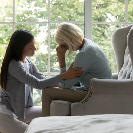 Daughter providing grief support to elderly mom