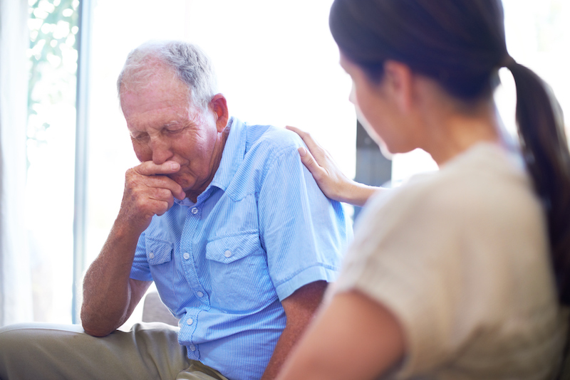 A woman looking for signs that her senior parent needs extra care