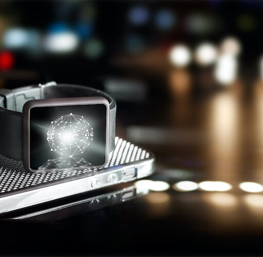 Close up of a smart watch laying on a table, as an example of wearable technology