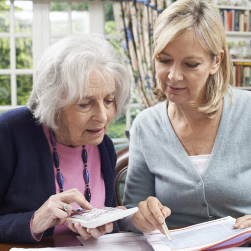 Mother and daughter partaking in financial planning for seniors