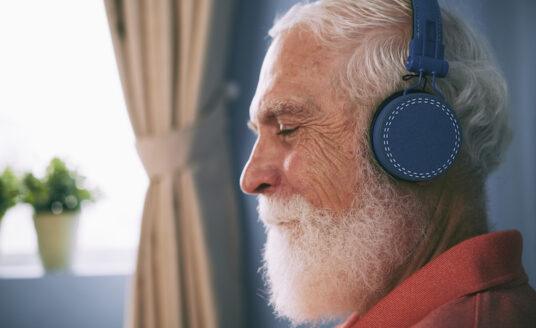 A man listens to music to manage sundown syndrome