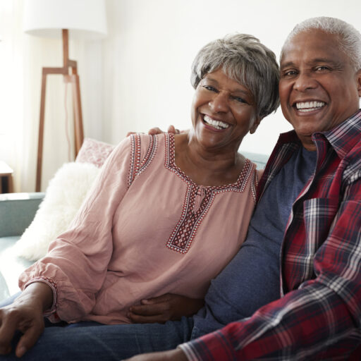 Smiling senior couple considering important retirement questions to ask